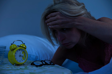 Woman struggling to wake up in the morning
