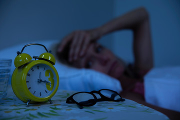 Woman struggling to wake up in the morning