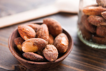 almond nut in a bowl on wooden table