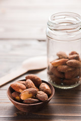 almond nut in a bowl on wooden table