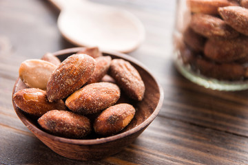 almond nut in a bowl on wooden table