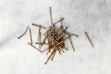 Rusty nails on gray background