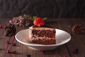 Chocolate strawberry cake on wood boad