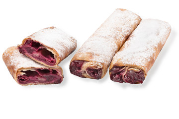 Baking puff pastry, one pastry in the cut. Sweet pastries with cherries, powdered sugar jam on a...