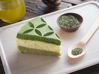 green tea matcha cake on wood board