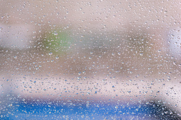 Naklejka na ściany i meble Drops on the glass during heavy rain.