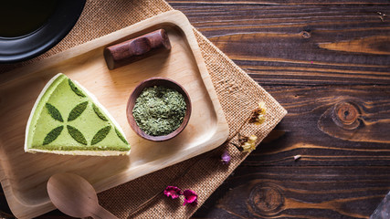 Obraz na płótnie Canvas green tea matcha cake on wood board