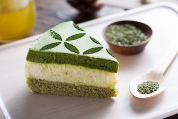 green tea matcha cake on wood board