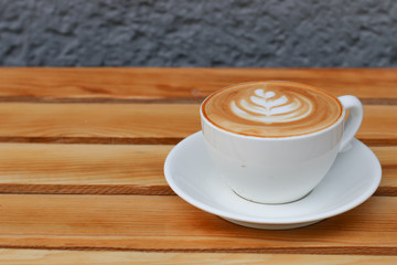 cup of coffee on wooden table