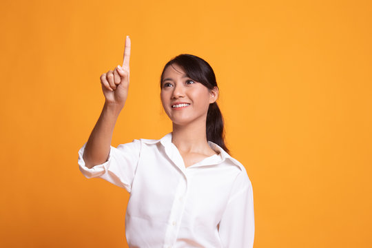 Asian Woman Touching The Screen With Finger.