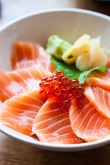 salmon sashimi put into white bowl