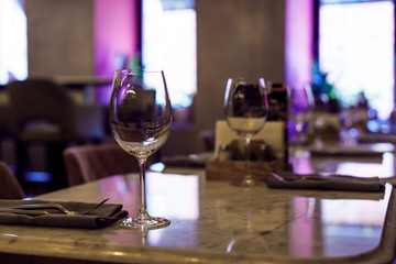Table setting in the restaurant. Empty wine glasse