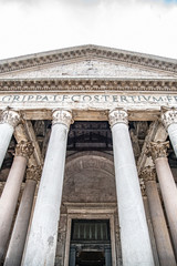 Roman Pantheon - detailed front bottom view of entrance with columns and tympanum. Rome, Italy
