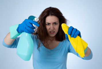 Attractive read haired woman angry and restless cleaning and housekeeping