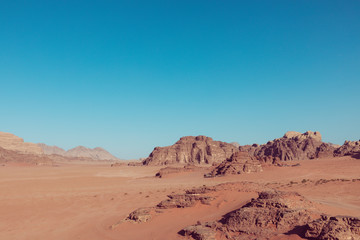 Fototapeta na wymiar Panoramic view of the Wadi Rum desert, Jordan. Blue sky at summer time.