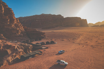 Fototapeta na wymiar Bedouin's car jeeps and tourists, Wadi Rum desert in Jordan, Middle East.