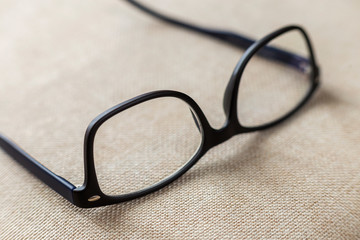 Reading spectacles, fashionable eyeglasses isolated on blurred white copy space background.