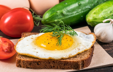 Fried egg on slice bread. Fried egg on slice bread with salad