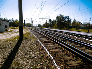 Fototapeta na wymiar The old railway. Rails and old wooden sleepers