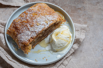 Sweet apple strudel with vanilla ice cream