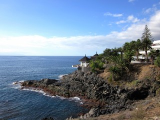 Beautiful view of the rocky coast near the beach at Playa de Los Cristianos, Tenerife, Spain, Europe