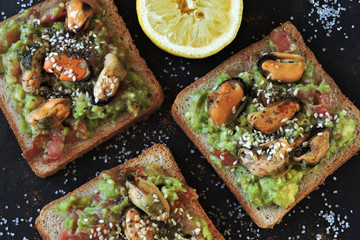 Healthy toasts with guacamole and mussels. Keto snack. Keto toasts Keto diet.