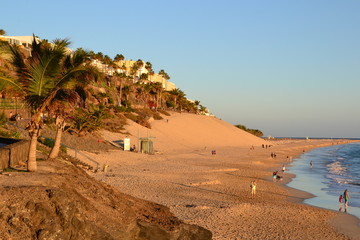 Morro Jable, Fuerteventura, Spain. The end of the day - breathtaking beach Playa del Matorral in the rays of the sunset