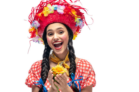 happy girl in festive clothes and Straw Hat holding sunflower Isolated On White