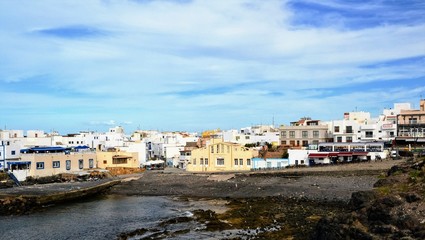 Fototapeta premium El Cotillo, Fuerteventura, Spain. View of El Cotillo buildings. El Cotillo coastal town in the municipality of la Oliva, located in the northern part of Fuerteventura, Canary Islands.