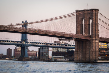 Naklejka premium Close up landscape of Manhattan Bridge and Brooklyn Bridge on the East River - New York City, NY