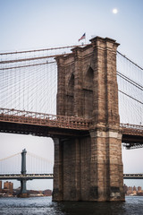 Vertical landscape of Manhattan Bridge and Brooklyn Bridge on the East River - New York City, NY