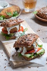 Gourmet Fish seafood burger with mayo and fresh vegetables