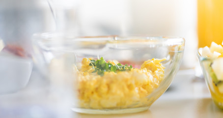 Breakfast table - butter, egg and mayo sandwich filling, sliced peppers