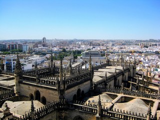 Aerial view of Seville city and Cathedral of Saint Mary of the See in Seville seen from the Giralda tower. Seville, Andalusia, Spain, Europe. 