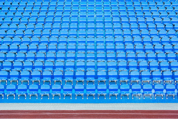 Fototapeta premium Blue empty seats on the tribune of the new stadium.