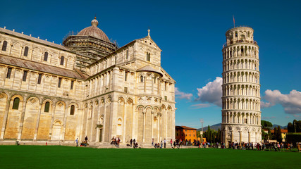 Tourists at Cathedral and Leaning Tower of Pisa in Italy
