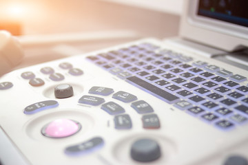 Obraz premium Closeup Ultrasound scanner equipmentin in clinic hospital. Diagnostics, sonography and health concept. Copyspace