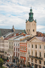 church tower over old building roofs. overcast weather