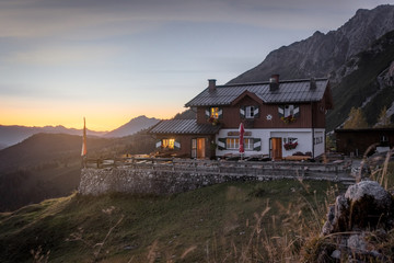 Mountain hut in the alps in the evening
