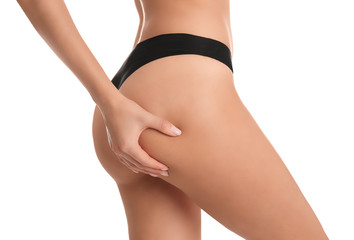 Closeup view of slim woman in underwear on white background. Cellulite problem concept - obrazy, fototapety, plakaty