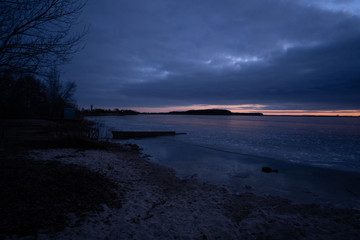 beautiful cold sunrise over a frozen lake