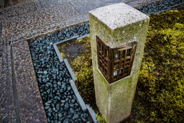 Minimalistic concrete stone lamp with wood