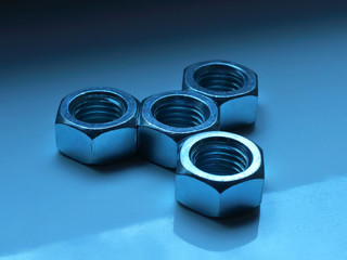 nuts and bolts in the form of a figure on the background
