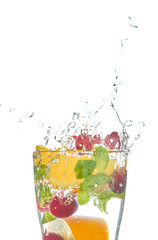 Detox lemonade with orange slices and berries with mint on a white background. refreshing drink.