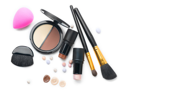 Face contouring makeup products over white. Highlight, shade, contour and blend. Make up artist tools