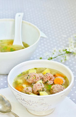 Italian Wedding Meatball Soup. soup in a beautiful white bowl