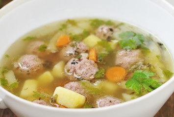 Italian Wedding Meatball Soup. soup in a beautiful white bowl