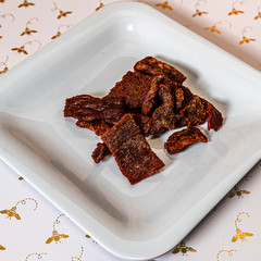 Beef jerky on a white plate