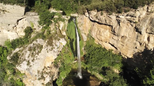Waterfall in Sant Miquel de Fai. Natural Park with monastery in Barcelona. Catalonia,Spain. 4k Drone Video