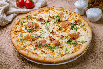 Pizza with Parma ham and arugula